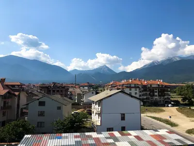 a view of a city with mountains in the background at Nickmar Studio-Apartment in Bansko