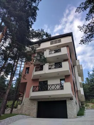 a building with balconies on the side of it at Bendida Apartments in Velingrad