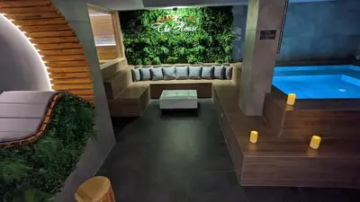 a pool in a house with a couch and a swimming pool at 