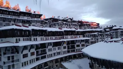 a group of buildings covered in snow at Snow Dreams 1 Grand Monastery in Pamporovo