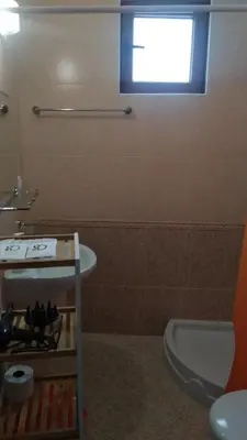 a bathroom with a sink and a toilet and a window at Snow Dreams 1 Grand Monastery in Pamporovo