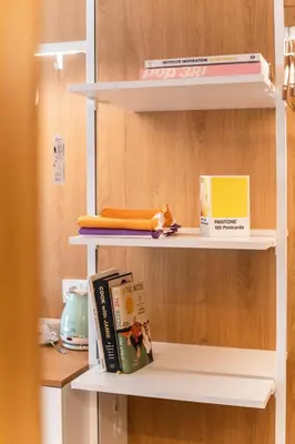 a book shelf with books and a book at Hotel Kitchen59 in Sofia