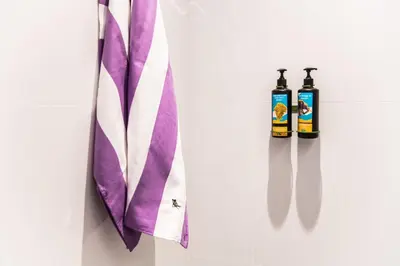 a purple and white tie and two bottles of sauce at Hotel Kitchen59 in Sofia