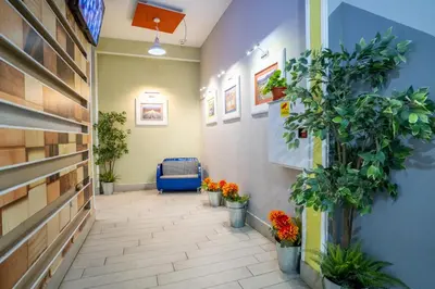a hallway with potted plants on the walls at Cozy little apartment in Studentski grad in Sofia