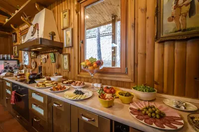 a kitchen with a bunch of food on a counter at Villa Anna Luxury Lake Residence in Shtarkelovo Gnezdo