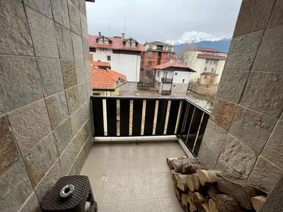 an empty balcony with a view of a city at Marina Apartment in Bansko