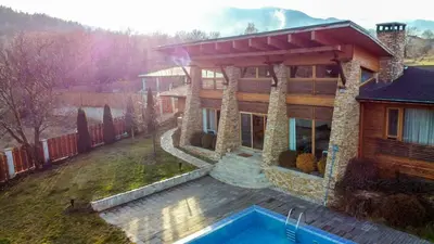 a house with a swimming pool in front of it at Luxury houses in Dobrinishte in Dobrinishte