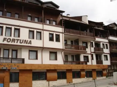 a large white building with the words forkuniya on it at Cozy Fortuna Apartments 46 in Bansko