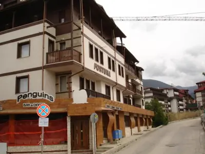 a building on the side of a street at Cozy Fortuna Apartments 46 in Bansko