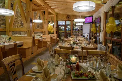 a dining room with tables and chairs and balloons at Studio - Apartments Castle Complex 2 in Pamporovo