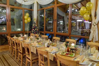 a dining room with a long table and balloons at Studio - Apartments Castle Complex 2 in Pamporovo