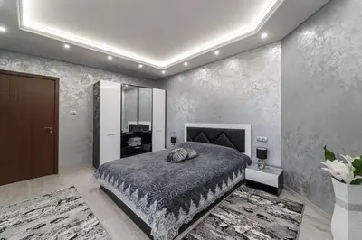 a bedroom with a king sized bed in a room at City Apartments - a brand new luxury & comfy 2 in Asenovgrad