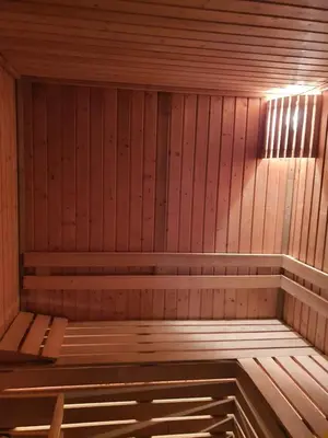a wooden sauna with a bench in it at GUEST HOUSE TONI СТАИ за ГОСТИ ТОНИ in Ribarica