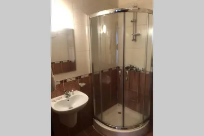a bathroom with a shower and a sink at Апартамент Пампорово Палас - Pamporovo Palace in Pamporovo