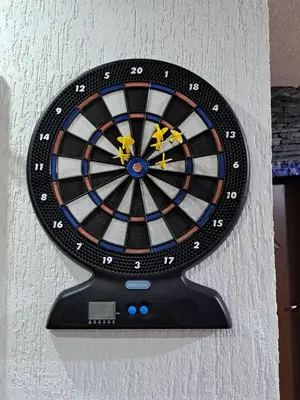 a dart board on the side of a wall at Вила Слънчев Бряг in Dospat