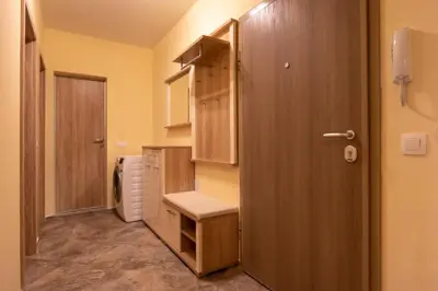 a small bathroom with a toilet and a door at Apartment City View 2 in Sofia