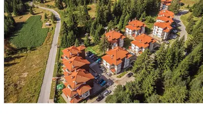 an aerial view of a large house with orange roofs at Апартамент Liora in Smolyan