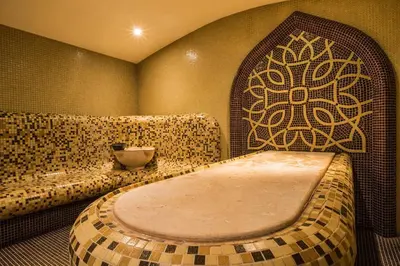 a room with a bath tub in the corner of a room at Приказното място - The Fairytale Place in Smolyan
