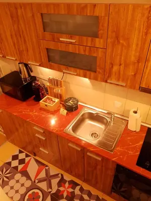 a kitchen with a sink and a counter top at Pinewood ANG Apartment, Semiramida Borovets Hills in Borovets