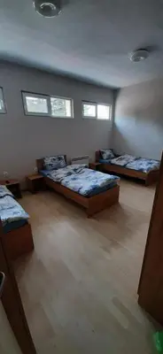 a room with three beds and two windows at Hostel Iliana Общежитие Илияна in Elin Pelin
