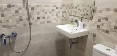 a bathroom with a sink and a shower at Апартаменти Гювийски in Sapareva Banya