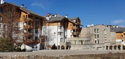 a group of buildings in front of a building at Луксозно студио в Банско - малко кътче от рая. in Bansko