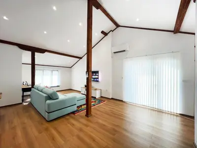 a living room with a couch and a table at Stylish loft studio with great view to Ardino in Ardino