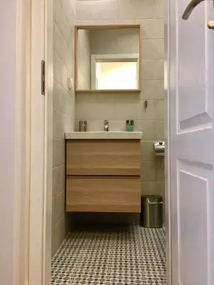 a bathroom with a sink and a mirror at Solunska Stylish Apartment in Sofia