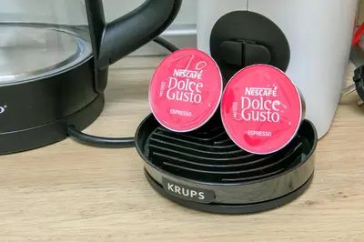 two red labels on top of a coffee pot at Dream Park Apartment in Sandanski