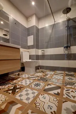a bathroom with a toilet and a glass shower at Pinewood Apartment Borovets in Borovets