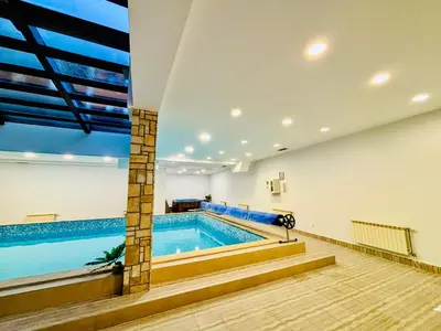 a large swimming pool in a large room with a swimming pool at Predela 1 - Studio 10 near Bansko Ski Lift in Bansko
