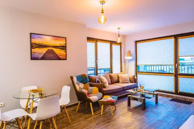 a living room with a couch and a table at Boutique 1-bedroom flat in the heart of the city in Plovdiv