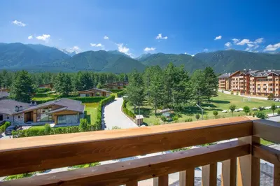 a view from the balcony of a resort at Luxury Chalets Pirin Golf & Country Club in Bansko