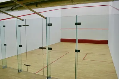 a gym with glass doors and a basketball court at Luxury Chalets Pirin Golf & Country Club in Bansko