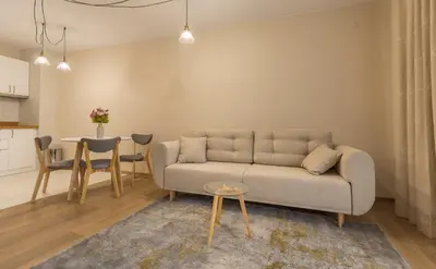 a living room with a couch and a table at Studio Talisman III in Sofia