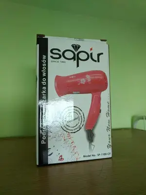 a book on a table with a red nail gun at Midtown Place Apartment Loft таванска стая с баня DORIS 2 in Plovdiv