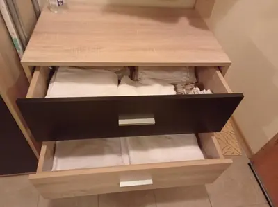 a wooden cabinet with white towels in it at Апартамент-студио в Банско-Разлог,Aspen Golf- C206 in Bansko