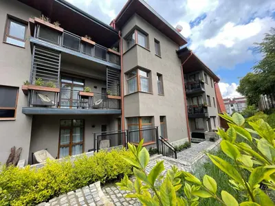 an apartment building with balconies and a stairway at Hotel COTA1110 in Beli Iskar