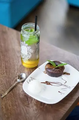 a plate of food and a drink on a table at Guest house Wishmore in Banya