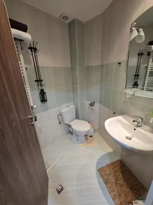 a bathroom with a toilet and a sink at Studio 1 Iceberg Borovets in Borovets