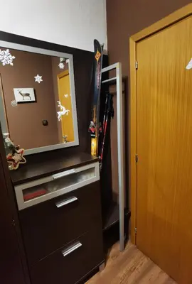 a room with a dresser with a mirror and skis at Studio 1 Iceberg Borovets in Borovets