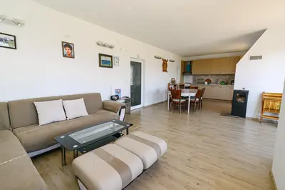 a living room with a couch and a table at AMAZING view, privacy and comfort - SPA Villa Krasi in Blagoevgrad