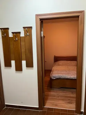 a bedroom with a door leading to a bed at Ski Zone at Gondola, Warm and Cosy, WiFi, AC, Netflix, Perfect One Bedroom appartment, Beautiful View in Bansko