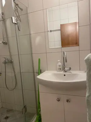 a bathroom with a sink and a shower at Ski Zone at Gondola, Warm and Cosy, WiFi, AC, Netflix, Perfect One Bedroom appartment, Beautiful View in Bansko