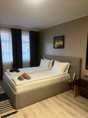 a bedroom with a large bed in a room at Paradise dreams Velingrad in Velingrad