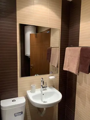 a bathroom with a sink and a toilet and a mirror at Paradise dreams Velingrad in Velingrad