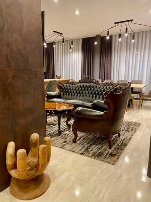 a living room with a couch and a chair at Kleptuzaparts in Velingrad