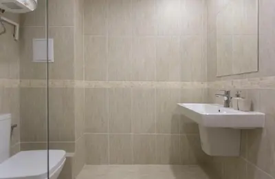 a bathroom with a sink and a toilet and a shower at Modern and Bright Apartments near Center - FREE PARKING in Sofia