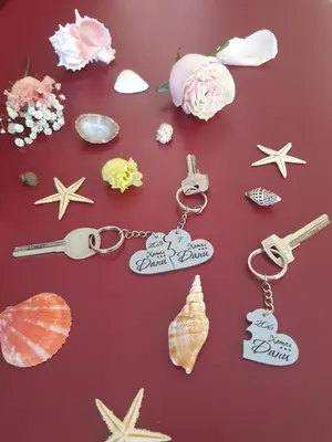 a group of key chains and seashells on a table at Хотел Дани in Sandanski