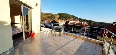 a balcony with a view of a building at Хотел Дани in Sandanski
